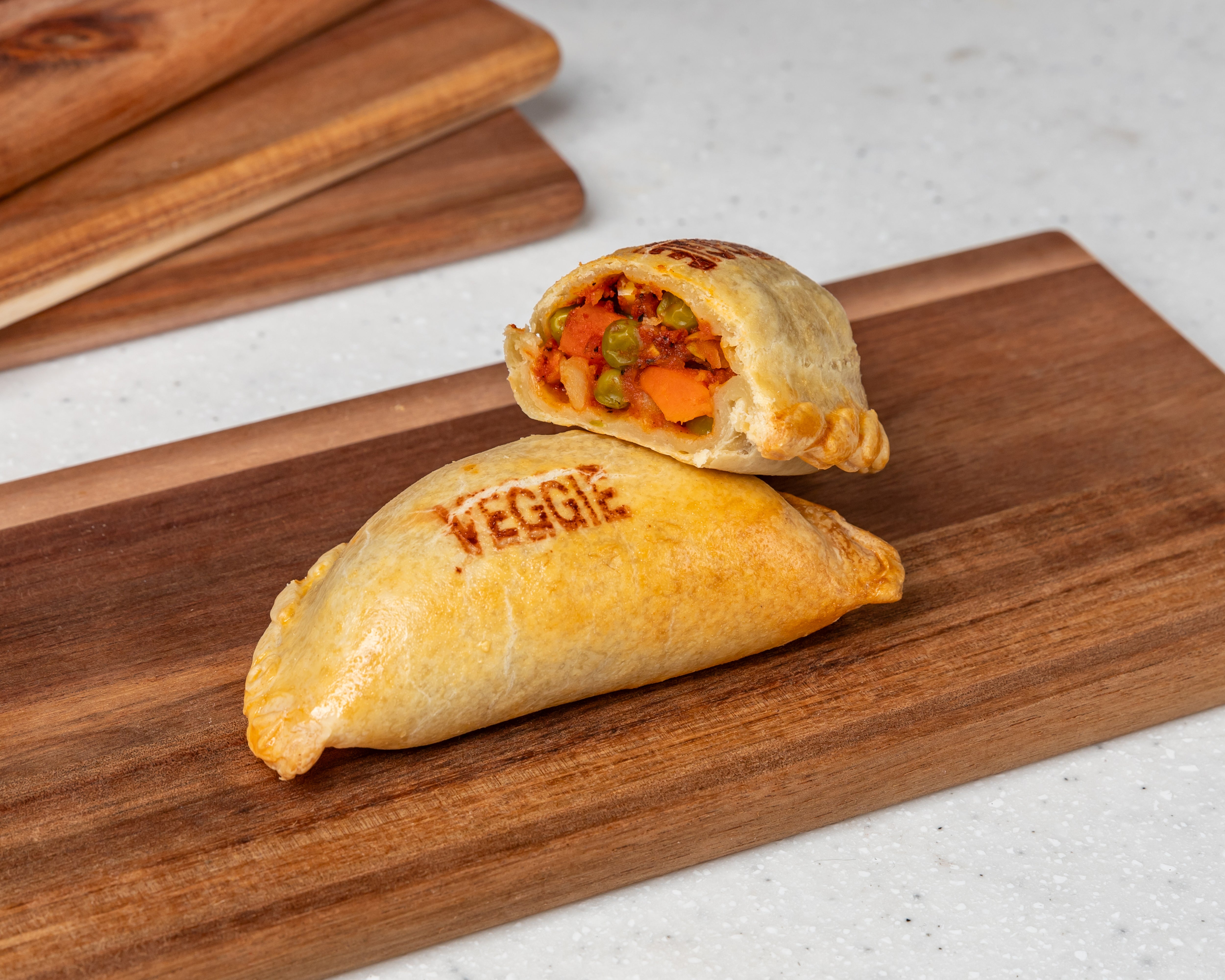 Chorizo Empanada filled with Spanish chorizo, onions, potatoes, peppers, and mixed vegetables – golden and crispy from Cholito Empanadas in Sydney